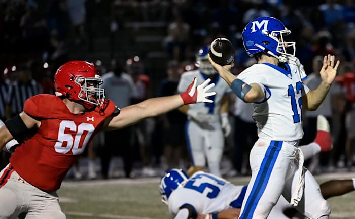Brentwood Academy s Hank Weber (60) reaches in trying to stop McCallie quarterback Jeremy St-Hilaire (12) from passing the ball during an high school football game Friday, Sept. 15, 2023, in Brentwood, Tenn.